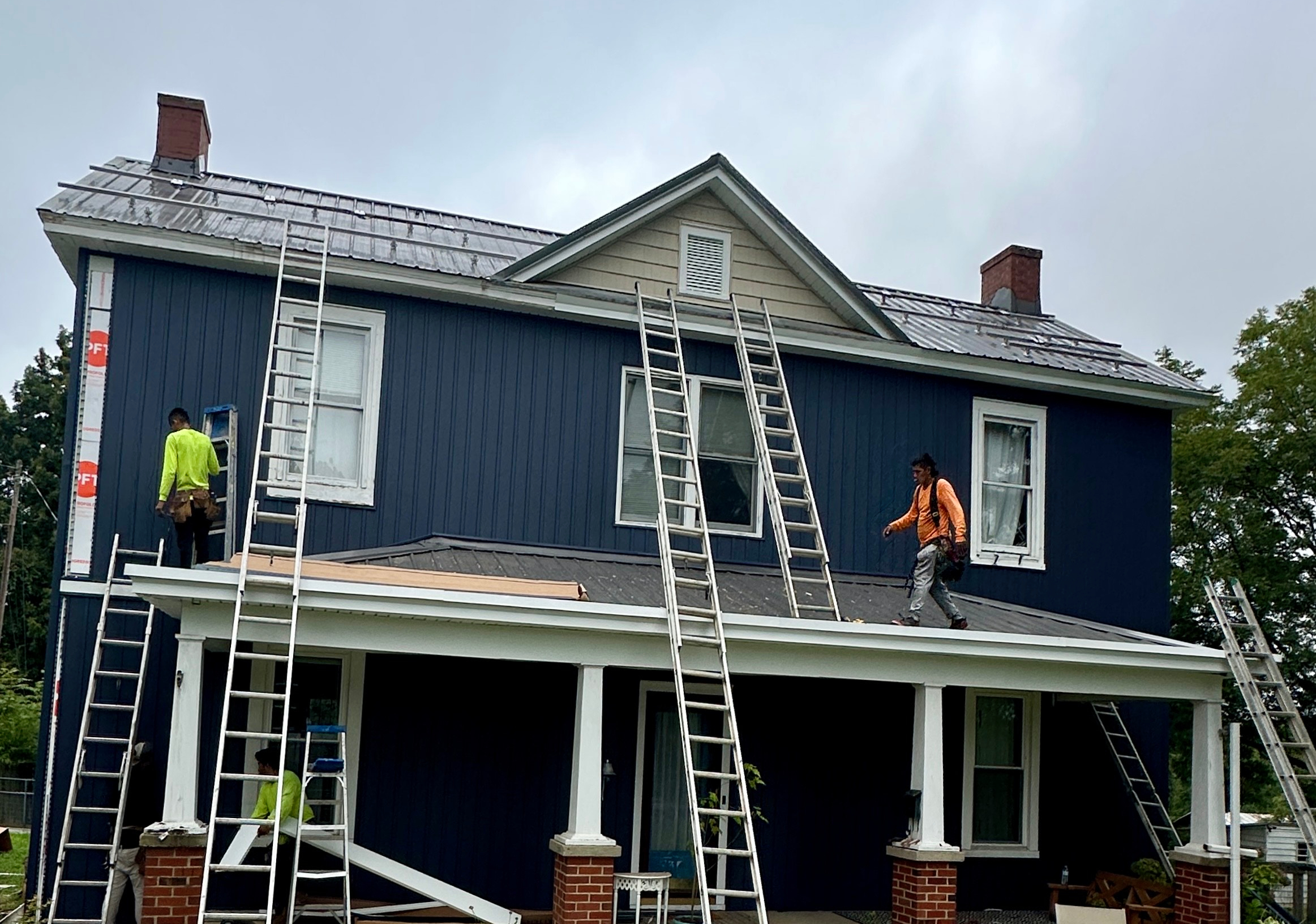 Crew installing siding