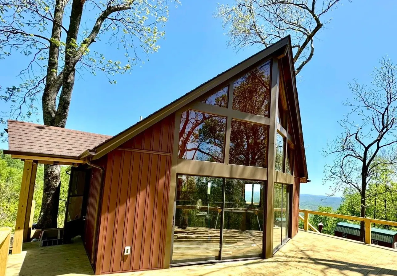 Red board and batten siding on an A-frame [confirm LP]