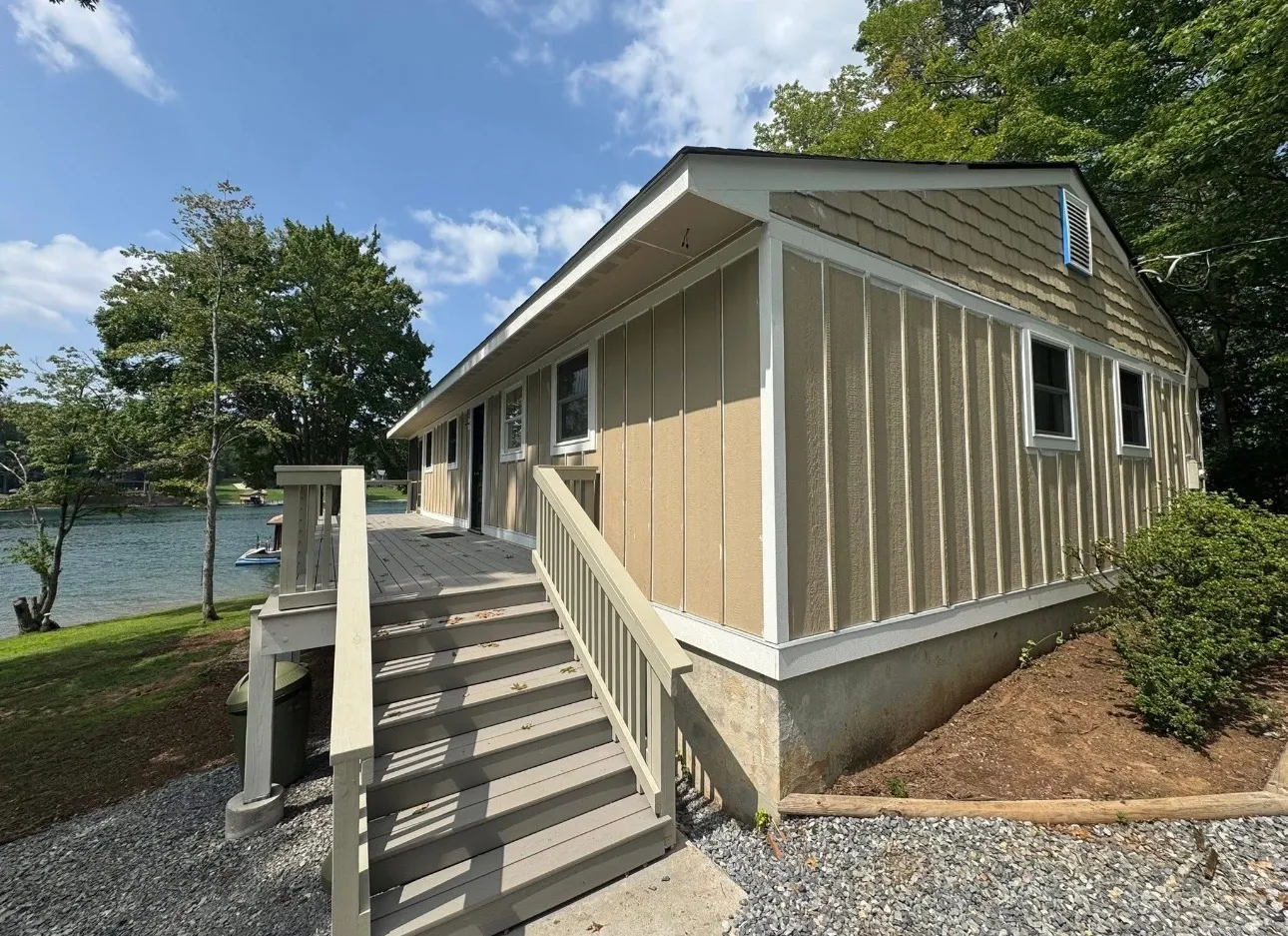 Tan board and batten siding on a lakeside home