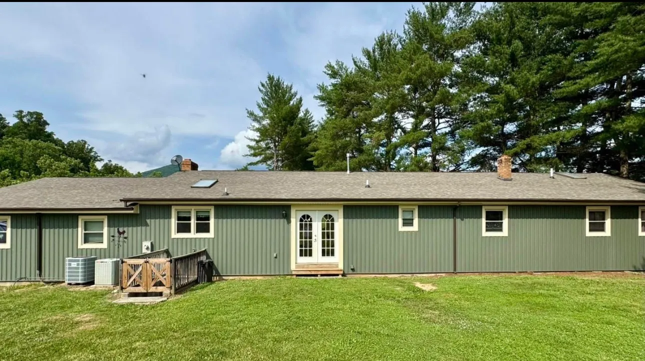 Green lap siding on a ranch home