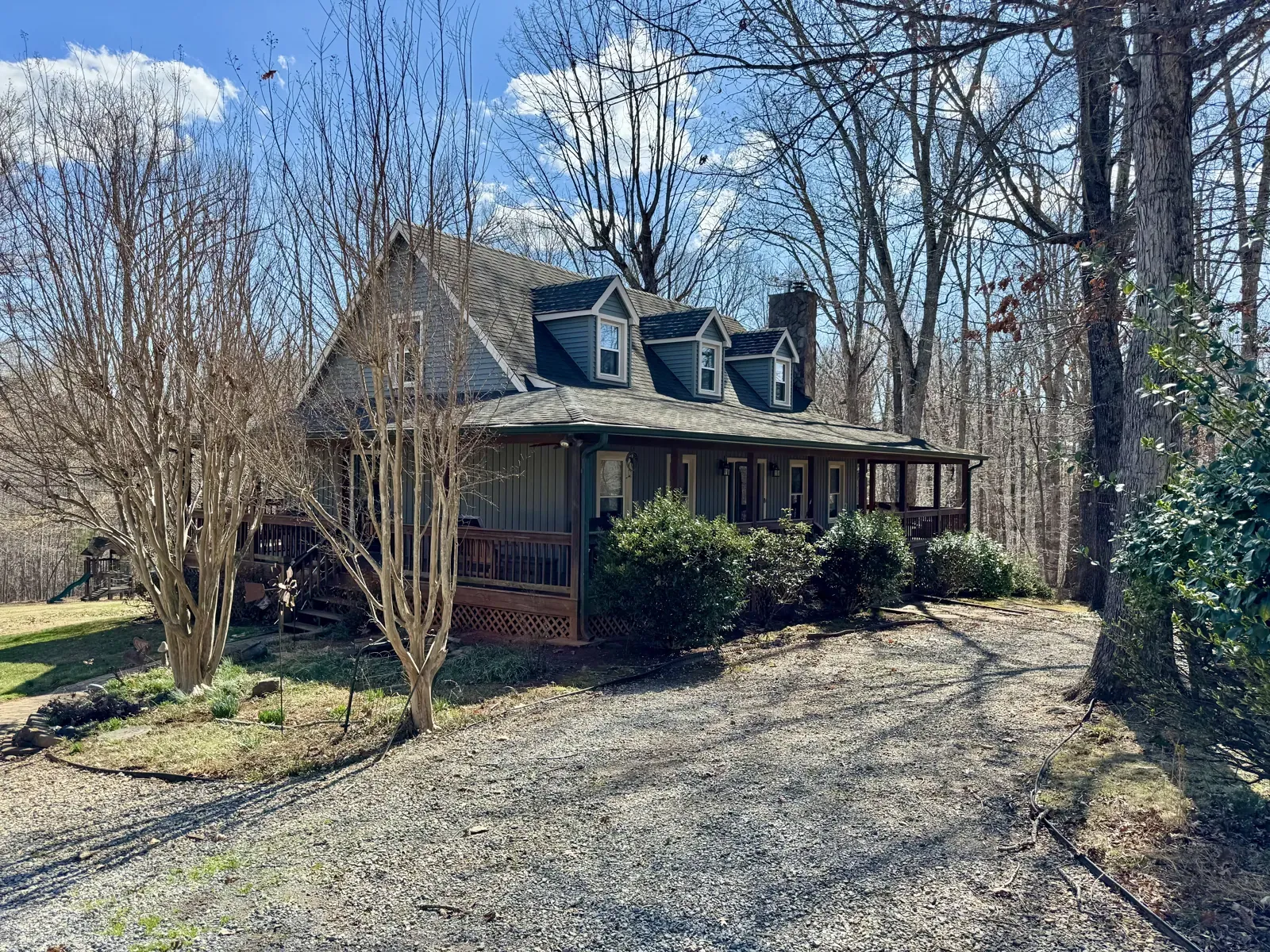 Cape-style home under trees in Moneta, VA