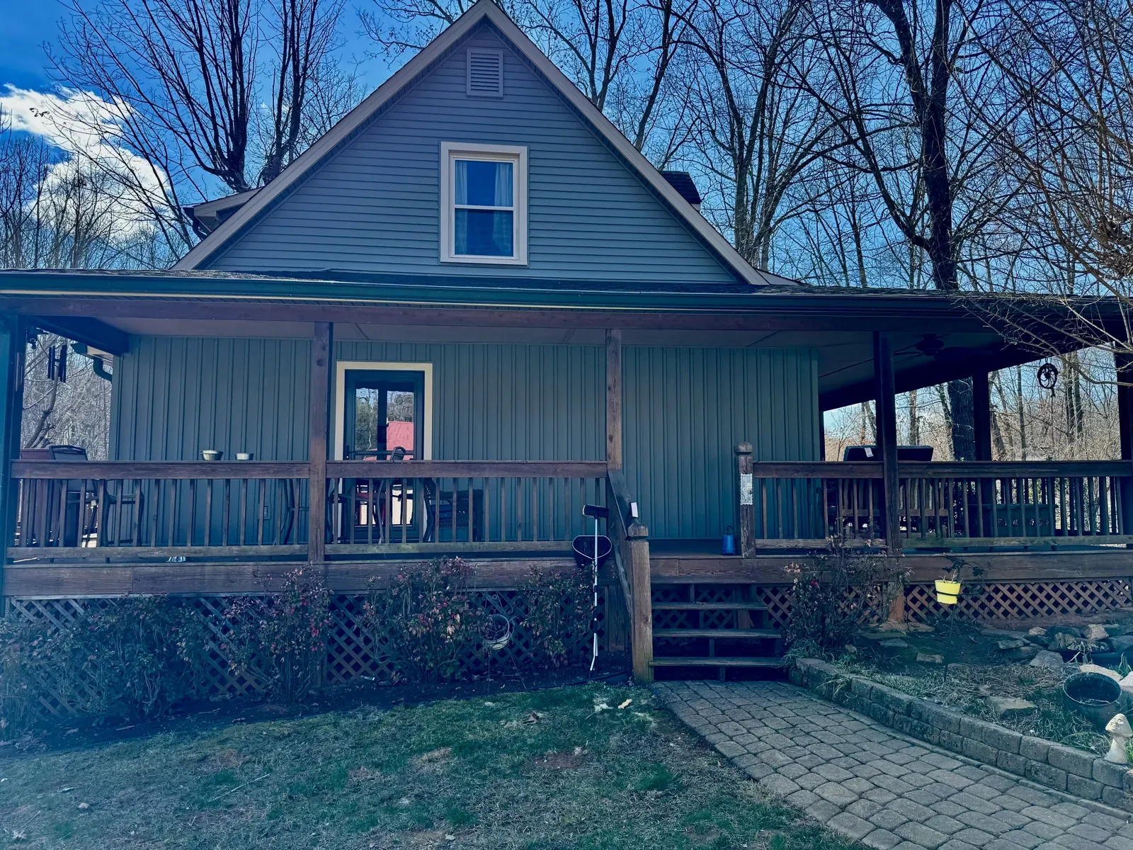 Porch and gable on a home under trees in Moneta, VA