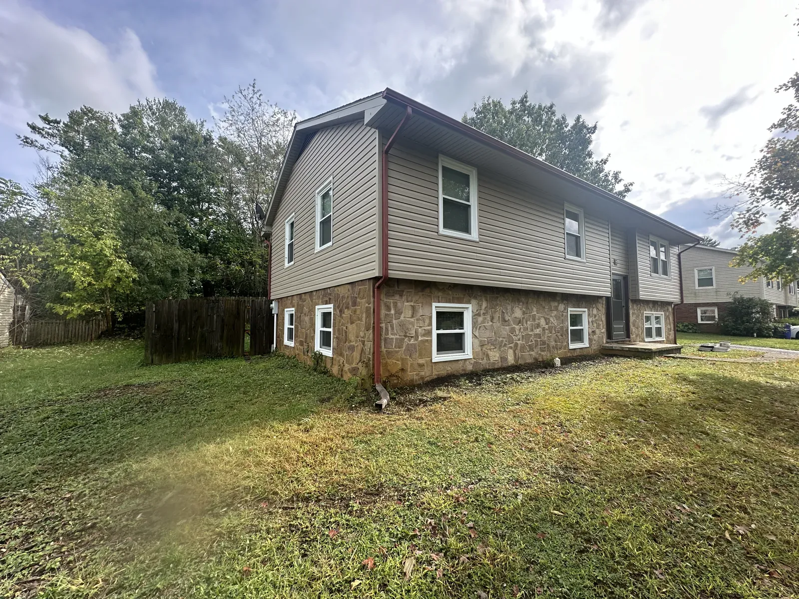 Lap siding over a stone base on a split-level home near Roanoke, VA