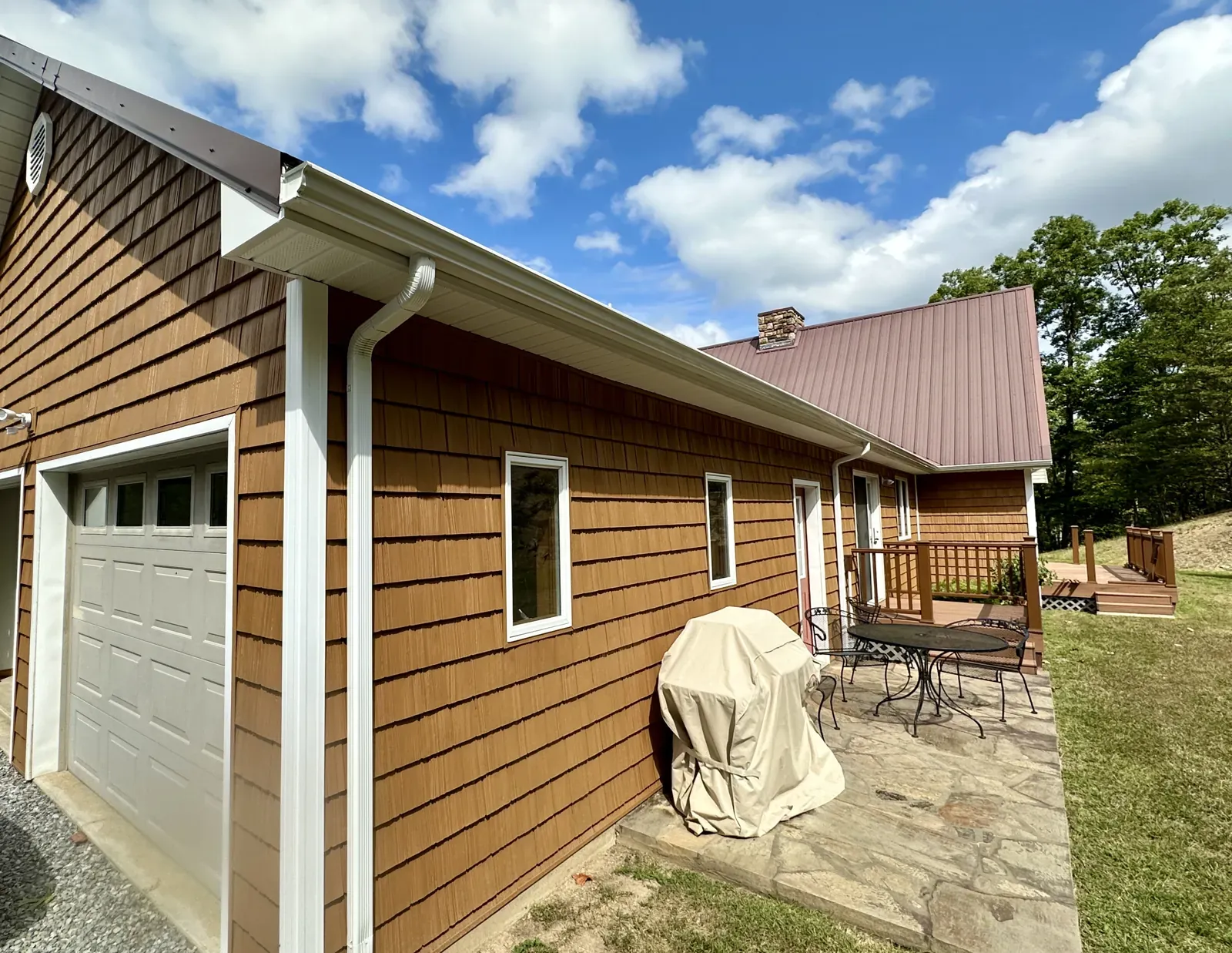 White gutter and downspout on a home in Thaxton, VA