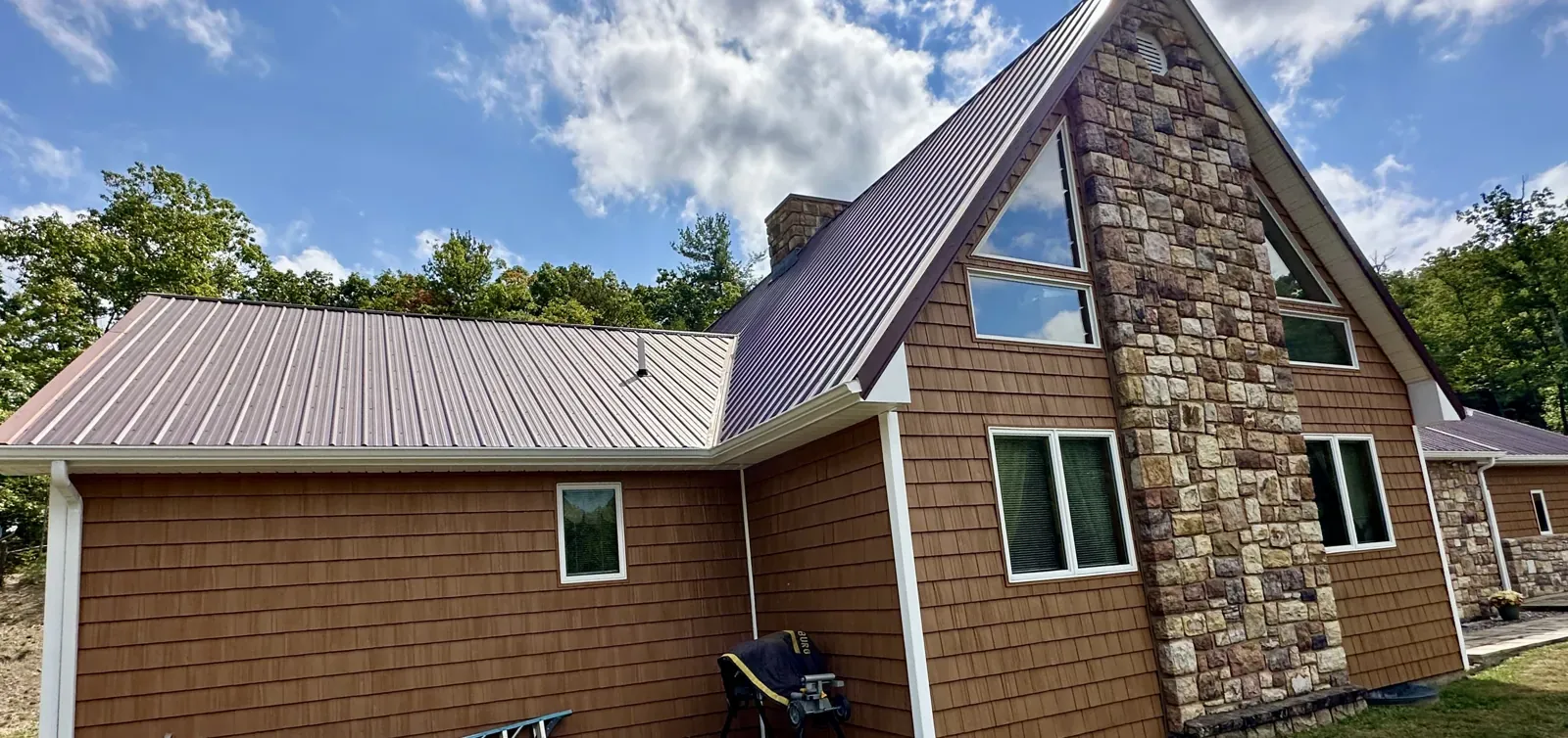 Shake-style siding and stone on an A-frame home in Thaxton, VA