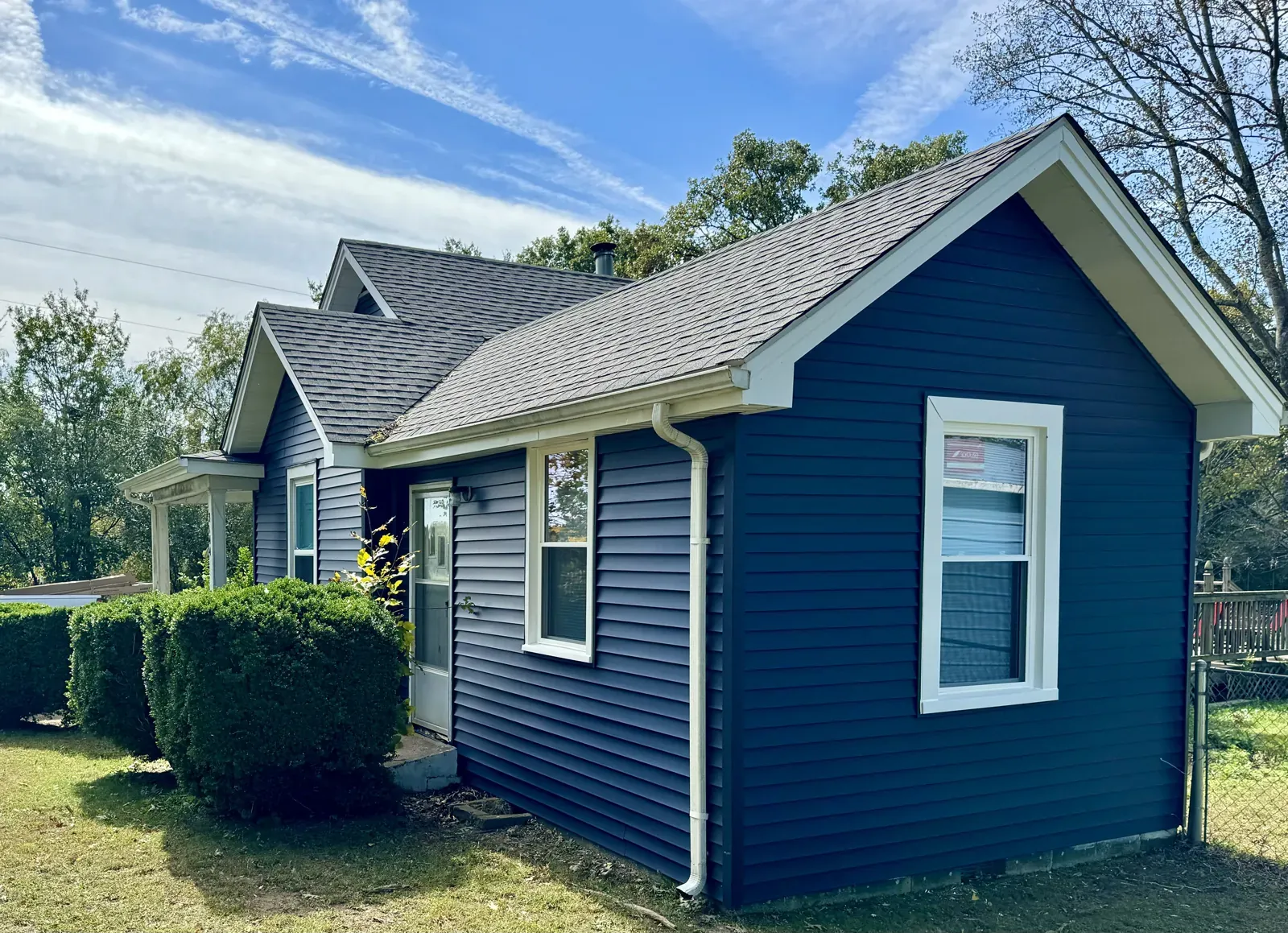 White downspout on a navy home in Thaxton, VA